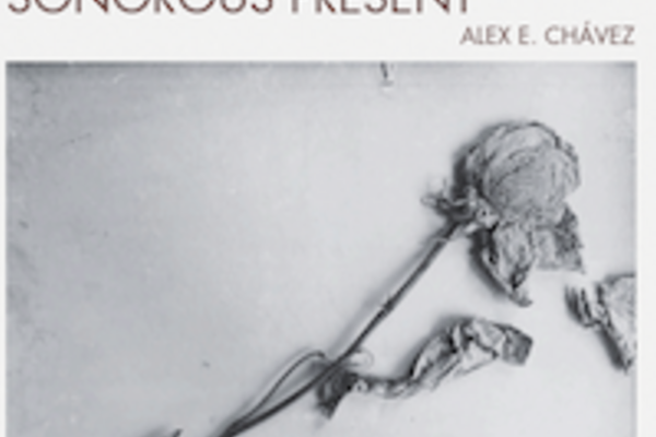 Album cover entitled Sonorous Present with a black and white photo of a dried and slightly pressed light-colored rose